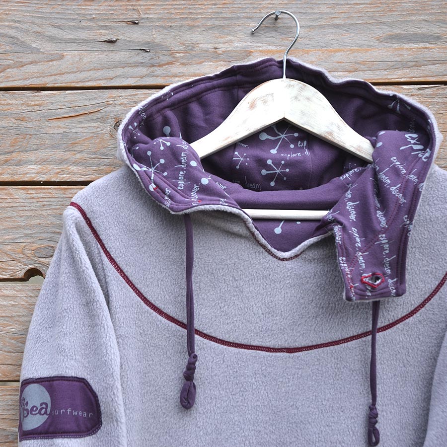 Close up Women's hoody dress in light grey and plum