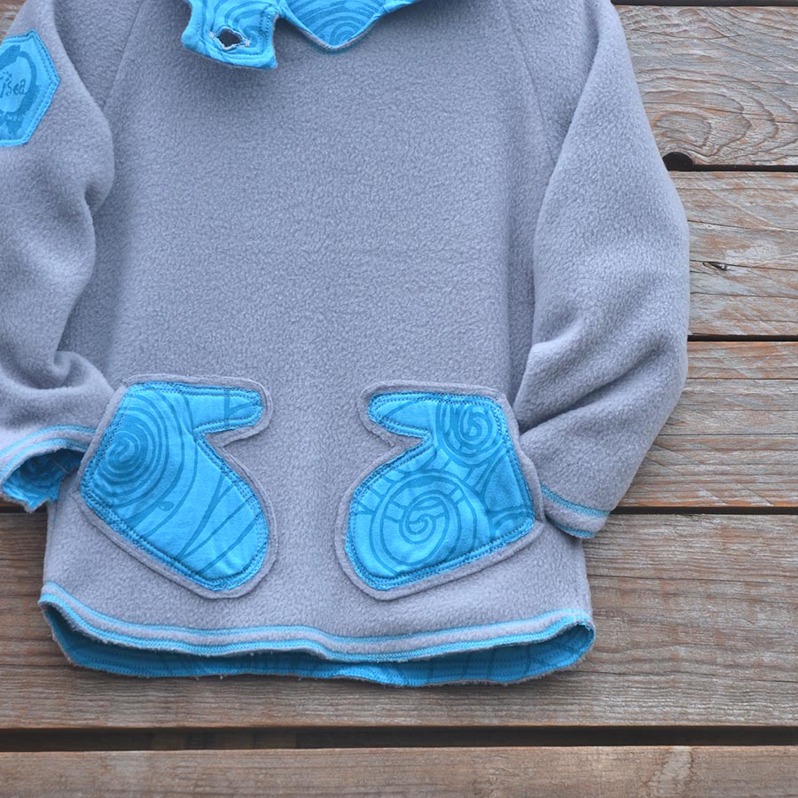Fleece close up Kid's reversible hoody in light grey/turquoise