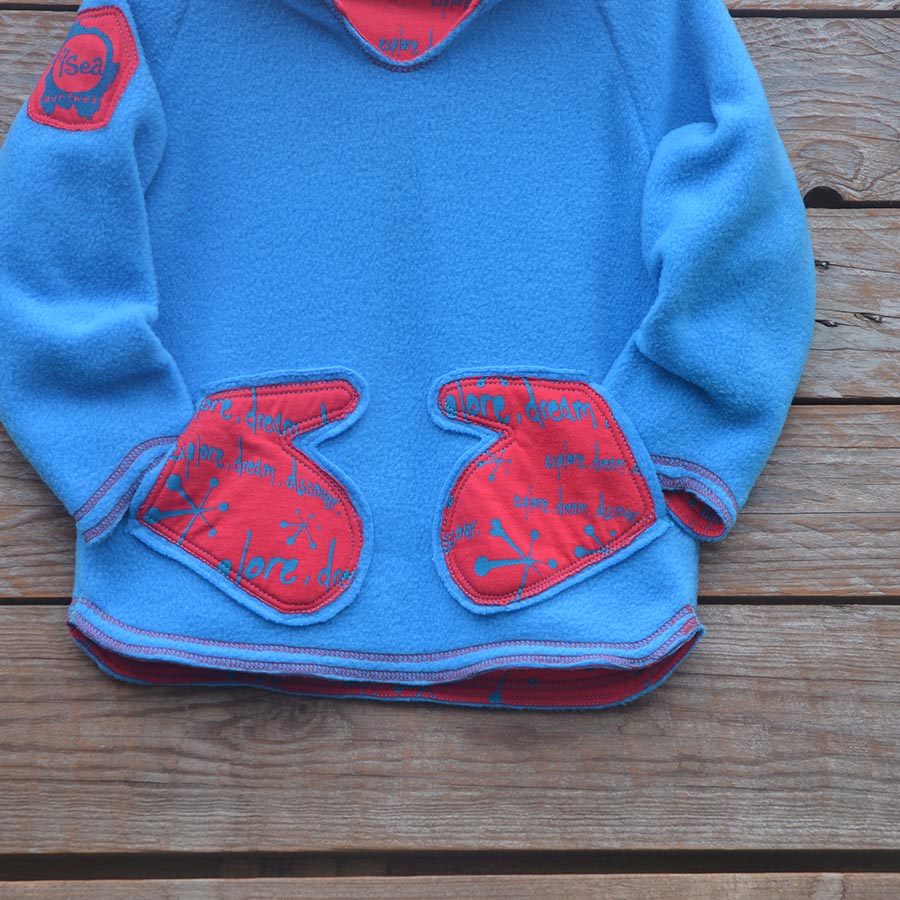Fleece close up Kid's reversible hoody in turquoise/red