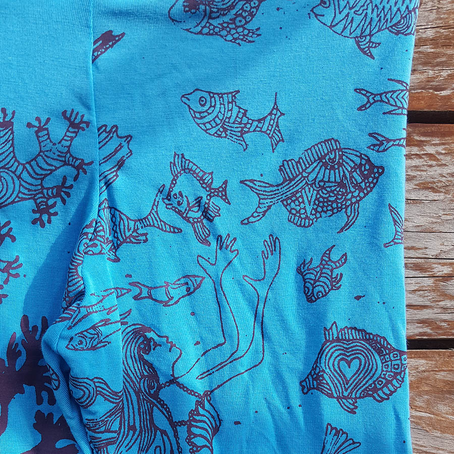Kid's leggings in turquoise/plum with mermaid scene Kid's leggings in turquoise/plum with mermaid scene